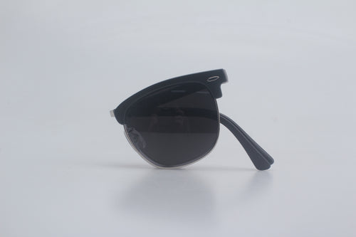 Classic black Clubmaster sunglasses featuring durable TR90 frames, polarized smoke lenses for glare reduction, and adjustable hinges, neatly folded against a minimalist white surface for men's and women's premium eyewear assortment, stylish sun blockers, full UV ray defense eyewear, timeless vintage vibes shades, upscale optic fashion items, beach-ready eye safeguard gear.