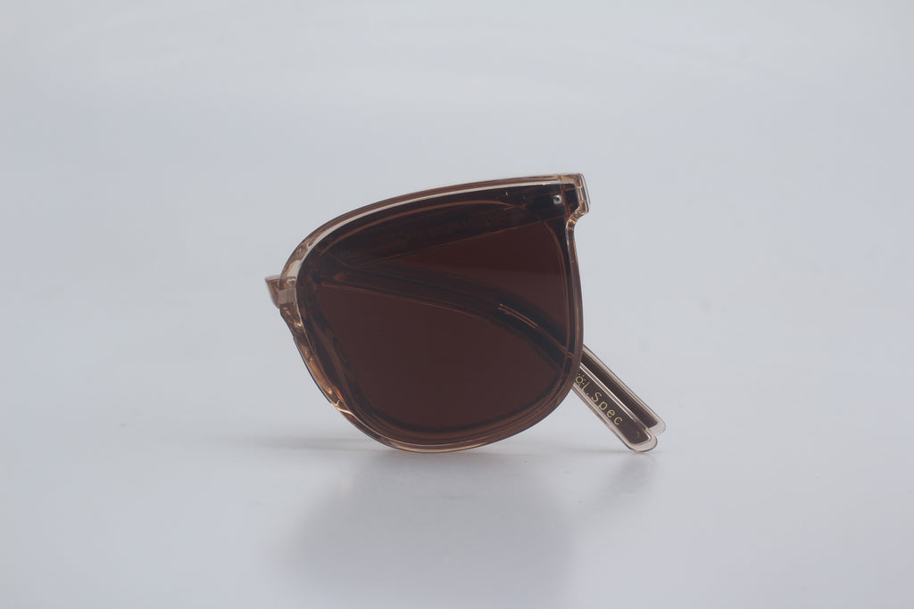 Square frame sunglasses with translucent brown TR90 frames and dark brown tinted lenses, folded on white background for fashion eyewear collection, designer shades, UV protection glasses, retro style sunnies, luxury optical accessories.