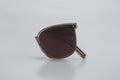 Square frame sunglasses with translucent brown TR90 frames and dark brown tinted lenses, folded on white background for fashion eyewear collection, designer shades, UV protection glasses, retro style sunnies, luxury optical accessories.